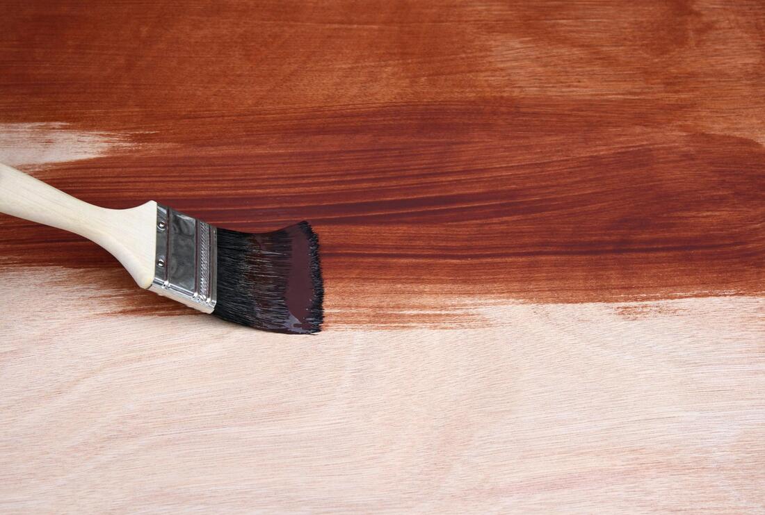 using brush to stain the wood